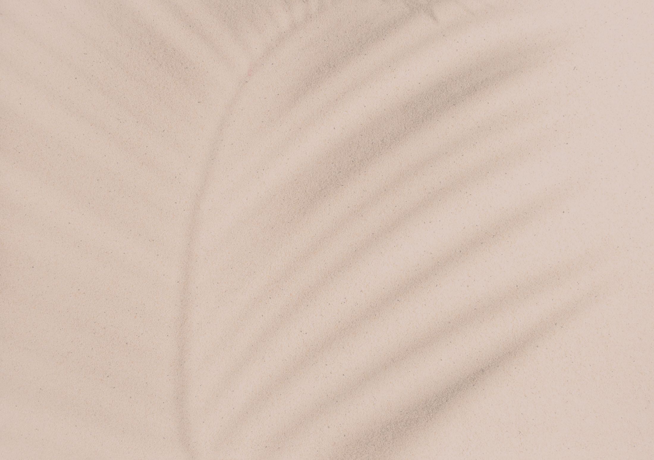 Sand texture with gentle shadows.